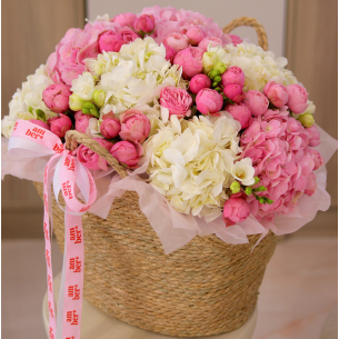 BIG 39 Arrangement in a basket with hydrangeas and bush peony roses