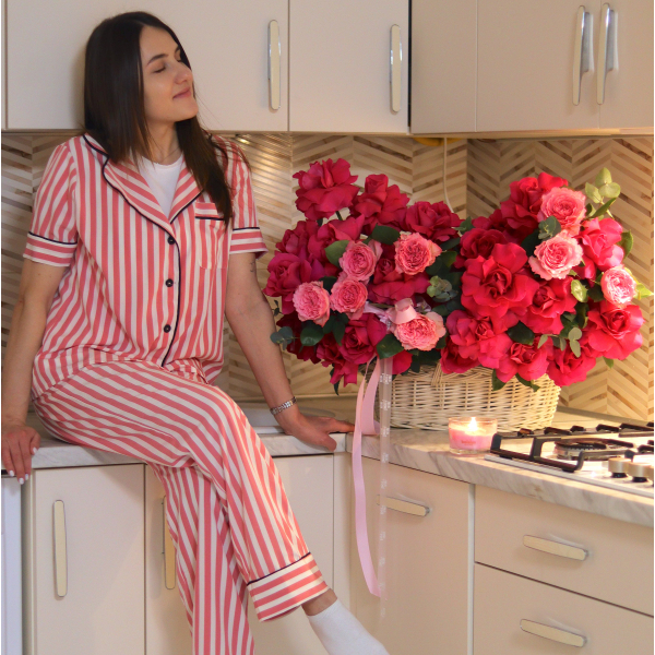A bright composition in a basket of 51 inverted roses and eucalyptus FLOWER BOX 02
