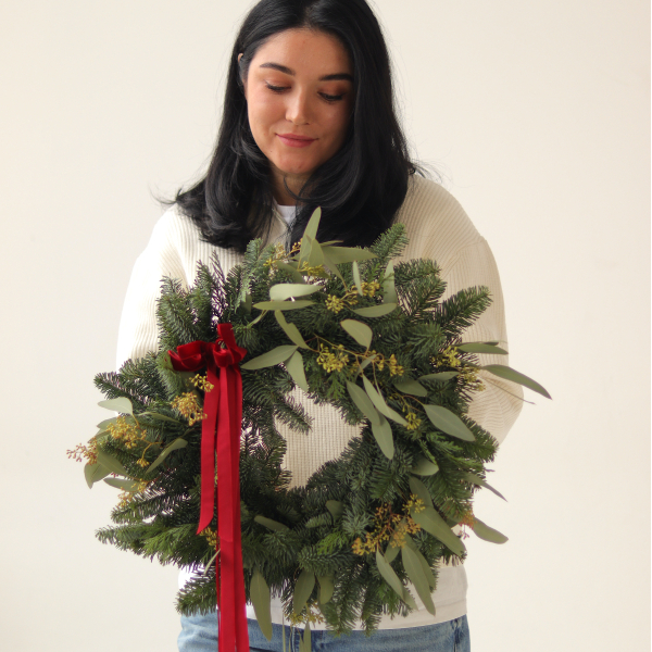 Christmas wreath from two types of Christmas tree and blooming eucalyptus. The diameter of the wreath is 40-45 cm. Christmas decor 02