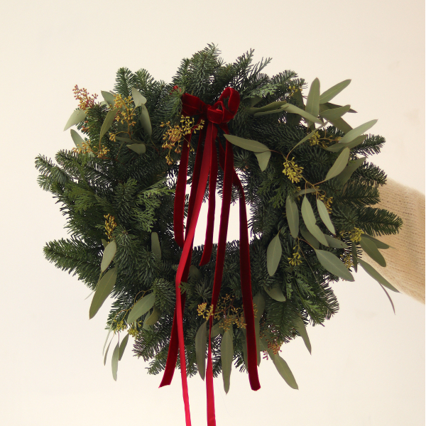 Christmas wreath from two types of Christmas tree and blooming eucalyptus. The diameter of the wreath is 40-45 cm. Christmas decor 02